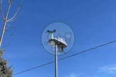Davis weather station Vantage Vue mounted atop pole