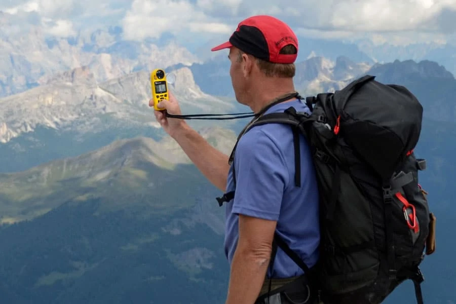 man using kestrel 5500 weather meter outdoors
