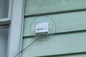 Davis weather station mounted on house siding