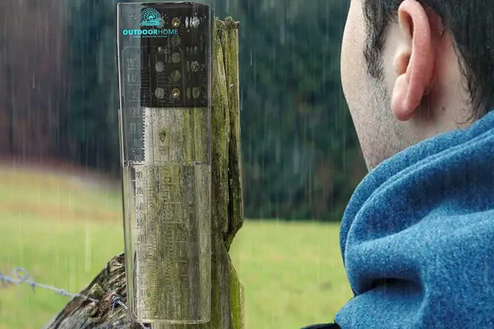 Man observing rainfall gauge during wet weather.