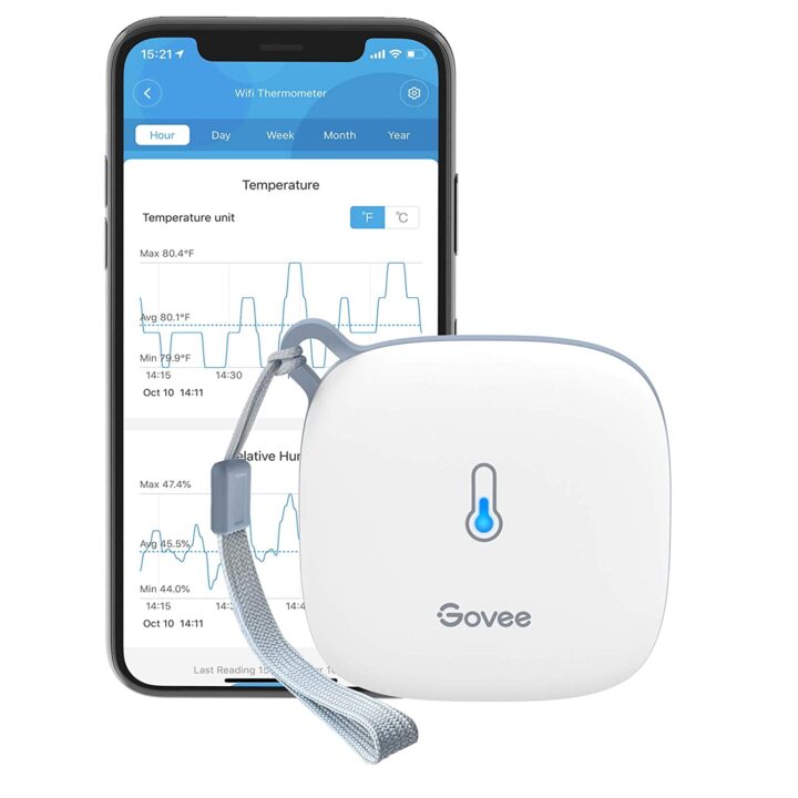 Smartphone with Govee temperature humidity monitor app.