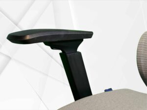 Close-up of adjustable office chair armrest.