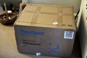 FlexiSpot ergonomic chair box in a room setting.