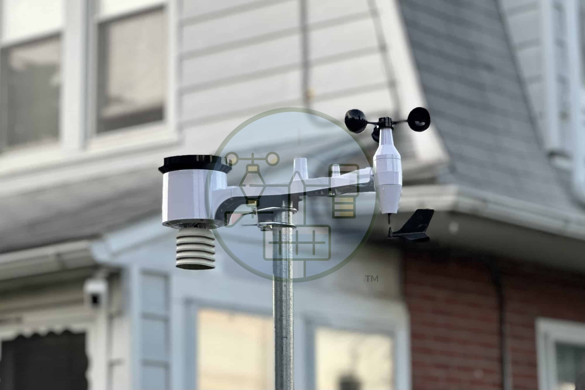 Weather station mounted on house wall.