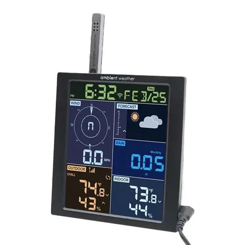 Digital weather station display showing temperature and forecast.